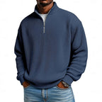 Close-up front view of the slate blue ribbed quarter-zip jumper with high stand collar