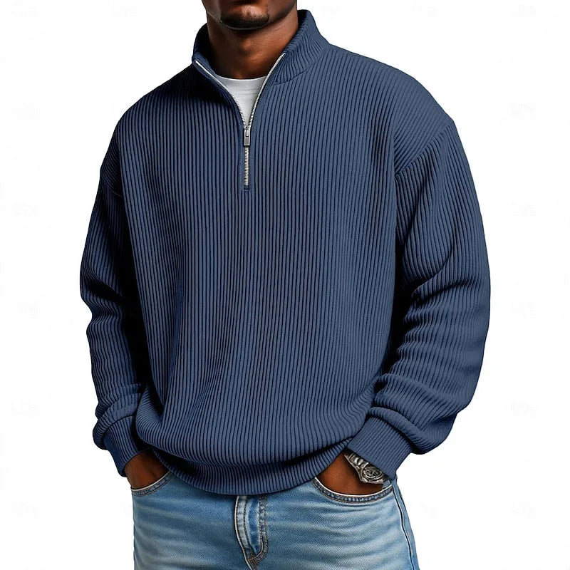 Close-up front view of the slate blue ribbed quarter-zip jumper with high stand collar