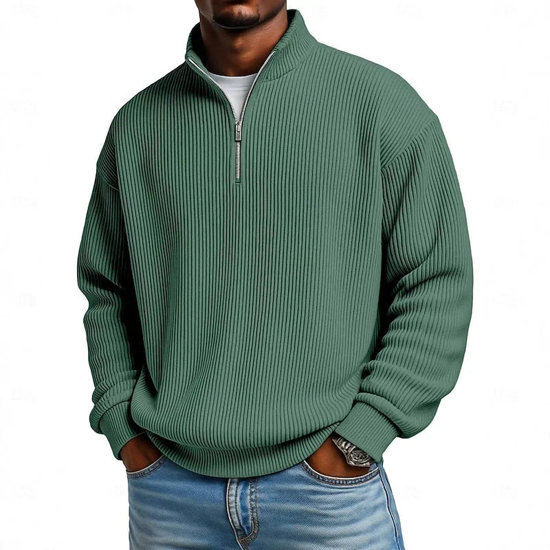 Close-up front view of the deep green ribbed quarter-zip jumper with unzipped collar detail
