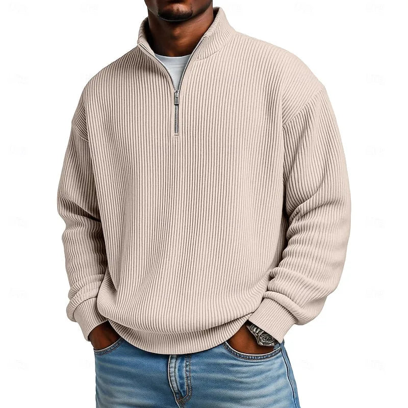 Close-up front view of the beige ribbed quarter-zip jumper worn with a white undershirt