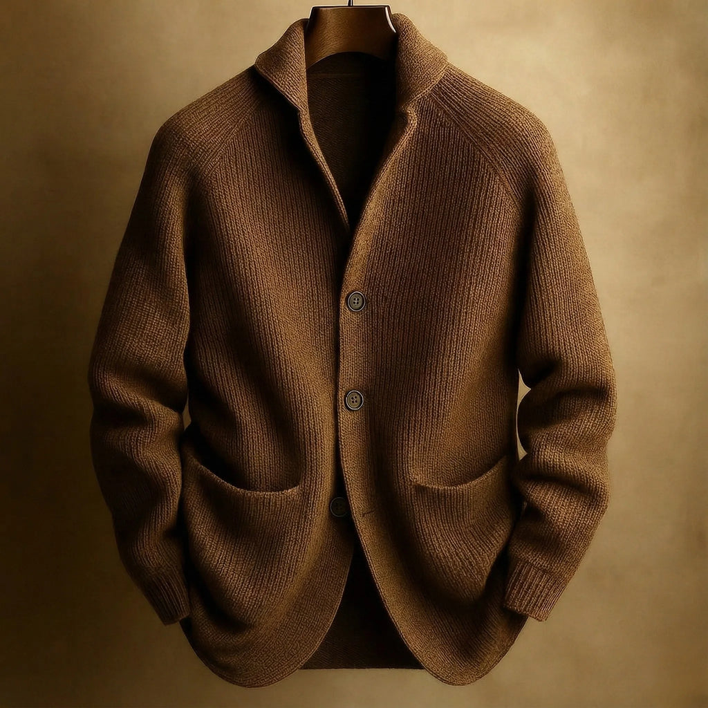 Brown ribbed wool cardigan with patch pockets and tortoiseshell buttons, displayed on a wooden hanger