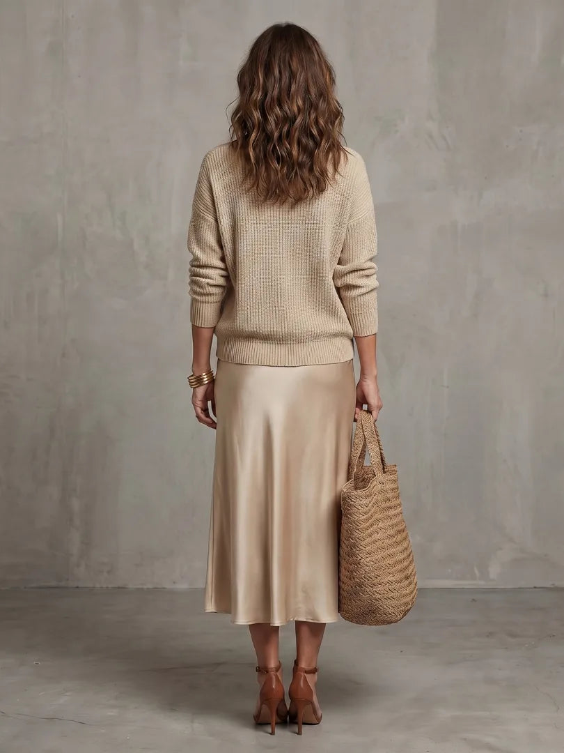 Side view capturing the movement and drape of the satin bias-cut skirt while walking