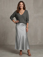 Front view emphasising the relaxed oversized fit of the V-neck knit jumper