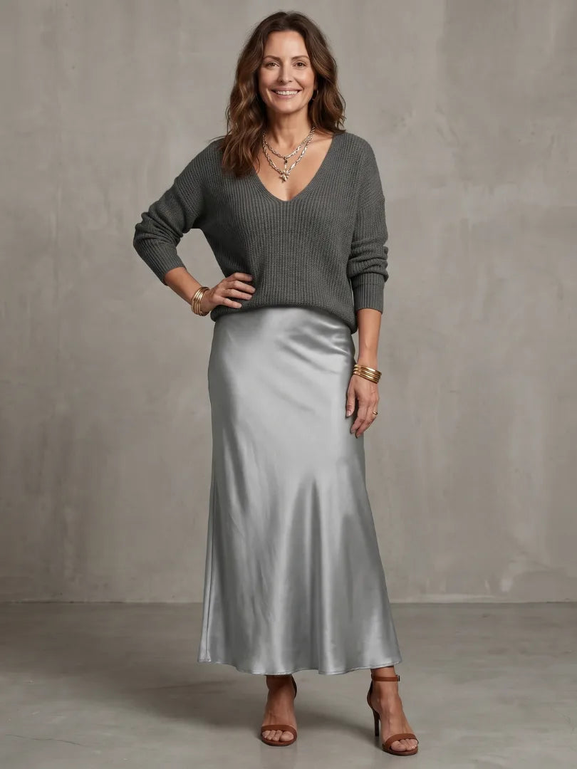 Front view emphasising the relaxed oversized fit of the V-neck knit jumper