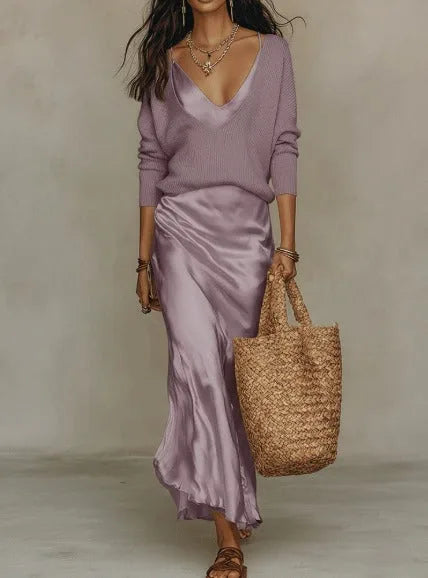 Full-length front view showing the satin slip dress and cream jumper combo paired with woven bag and sandals