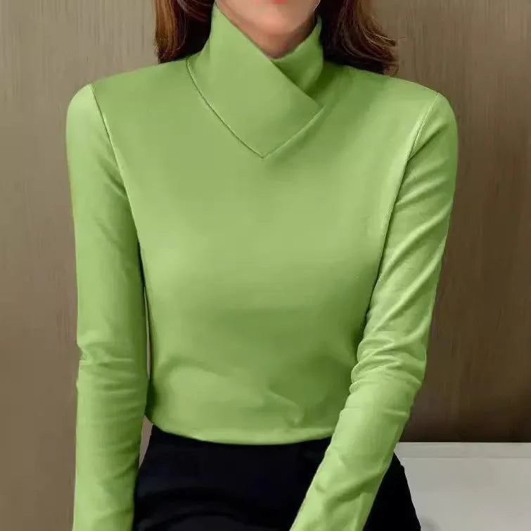 Green polo neck jumper with sculpted asymmetric collar detail, shown in a cropped front view.