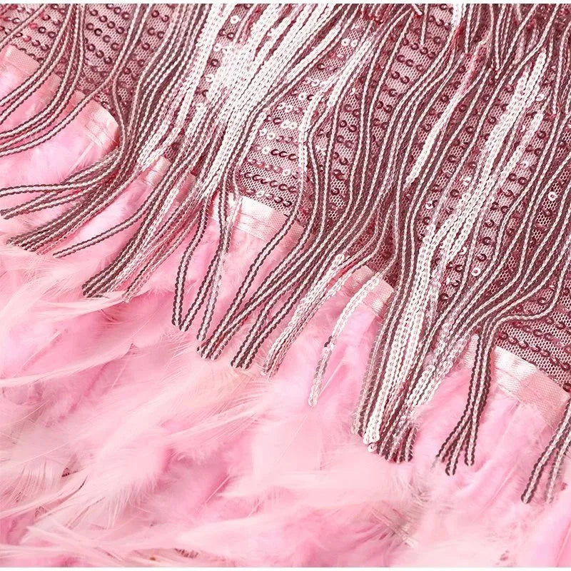 Full-length view of the sequin fringe mini dress showing the fitted bodice and flared fringe skirt