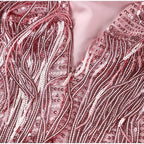 Detail shot of the feather hem trim at the bottom of the fringe mini dress