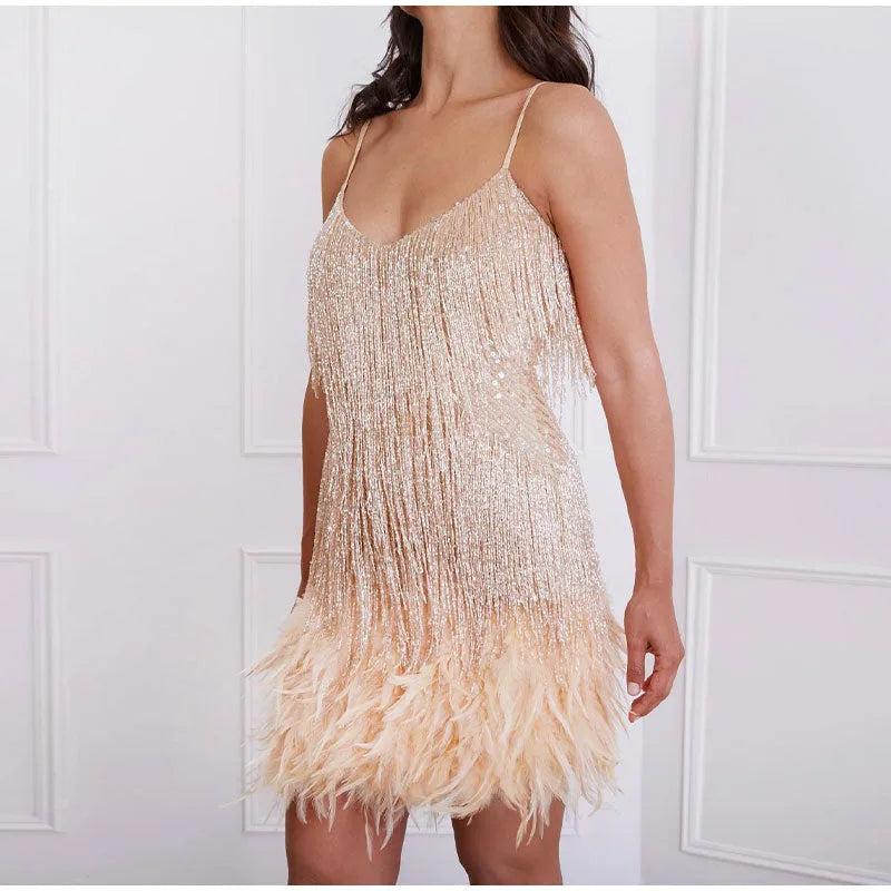 Close-up of the v-neckline and thin spaghetti straps of the sequin fringe mini dress