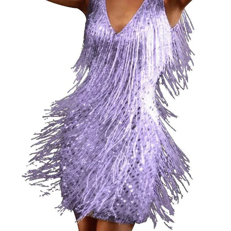 Close-up front detail of lilac sequin fringe mini dress showing layered tassel fringe over a V-neckline