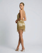 Side and back view of the gold fringe mini dress highlighting the chain-style straps and low back
