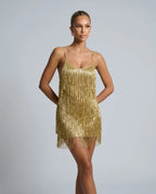 Close-up front view of the gold fringe mini dress showing the scoop neck and cascading fringe detail