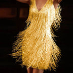 Front view of the gold sequin fringe mini dress paired with strappy metallic heels for an evening look