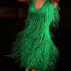 Model wearing the gold sequin fringe mini dress in a full-body pose showing the straight hemline
