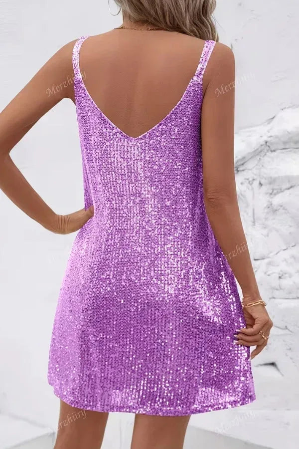 Back view of a purple sequin mini dress showing the flared skirt and sequin-covered straps