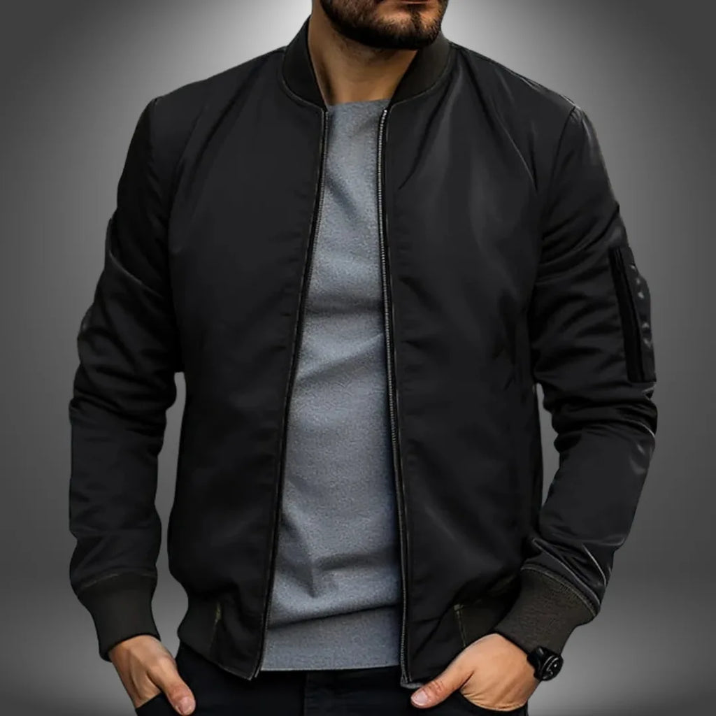 Black slim-fit bomber jacket with ribbed cuffs and hem, front zipper open, shown from the chest up