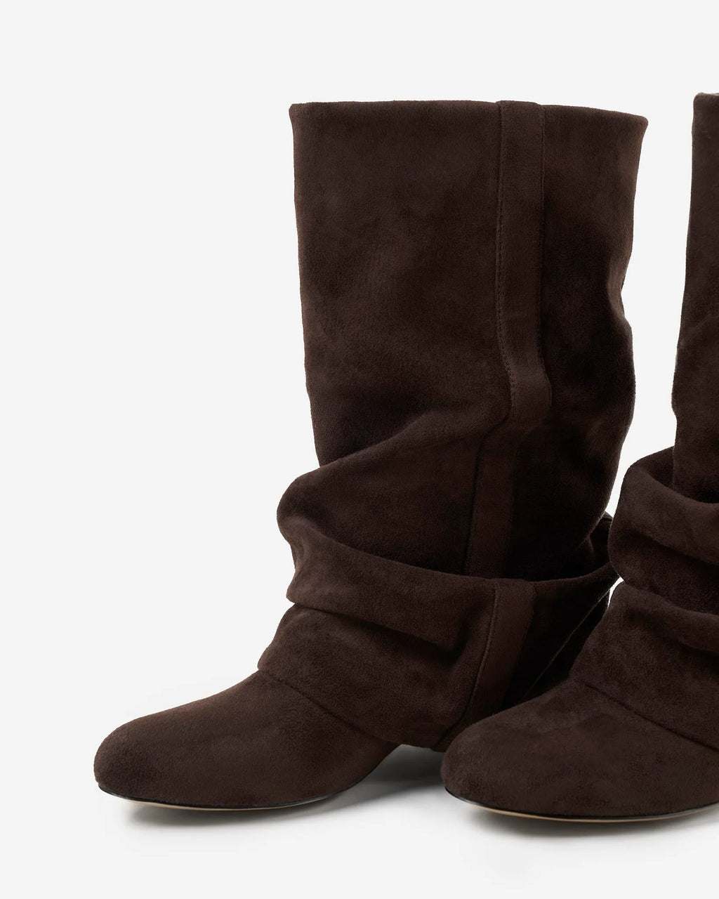 Close-up angled view of the toe and ruched ankle fold on a pair of dark chocolate suede slouchy boots