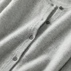 Mint green cardigan showing full-length view with dropped shoulders and ribbed cuffs