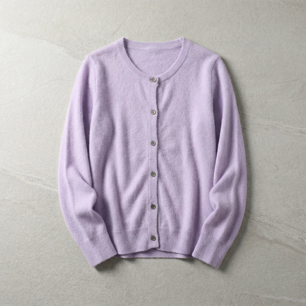 Lilac purple cardigan laid flat displaying soft knit fabric and ribbed trims on a light stone surface