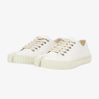 Angled pair view of white canvas split-toe trainers with cream laces and cream ribbed rubber sole