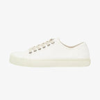 Side profile of a single white canvas split-toe trainer showing the low-top silhouette and ribbed sole