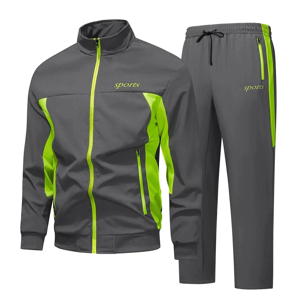 Dark grey and neon green matching tracksuit set with zip pockets, front view showing jacket and trousers together