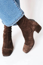 Front and side view of dark brown suede square-toe ankle boots with block heel
