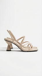 Side view of beige strappy heel sandal with square toe and cone-shaped kitten heel