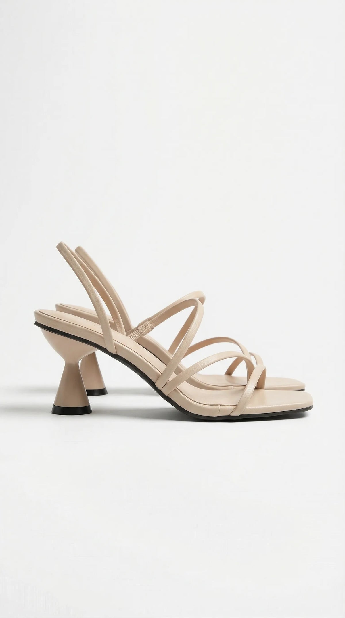 Side view of beige strappy heel sandal with square toe and cone-shaped kitten heel