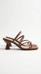 Side view of tan brown strappy sandal with square open toe and cone heel