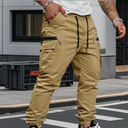 Khaki cargo trousers with visible stitching detail, drawstring waist and zip pocket on the thigh