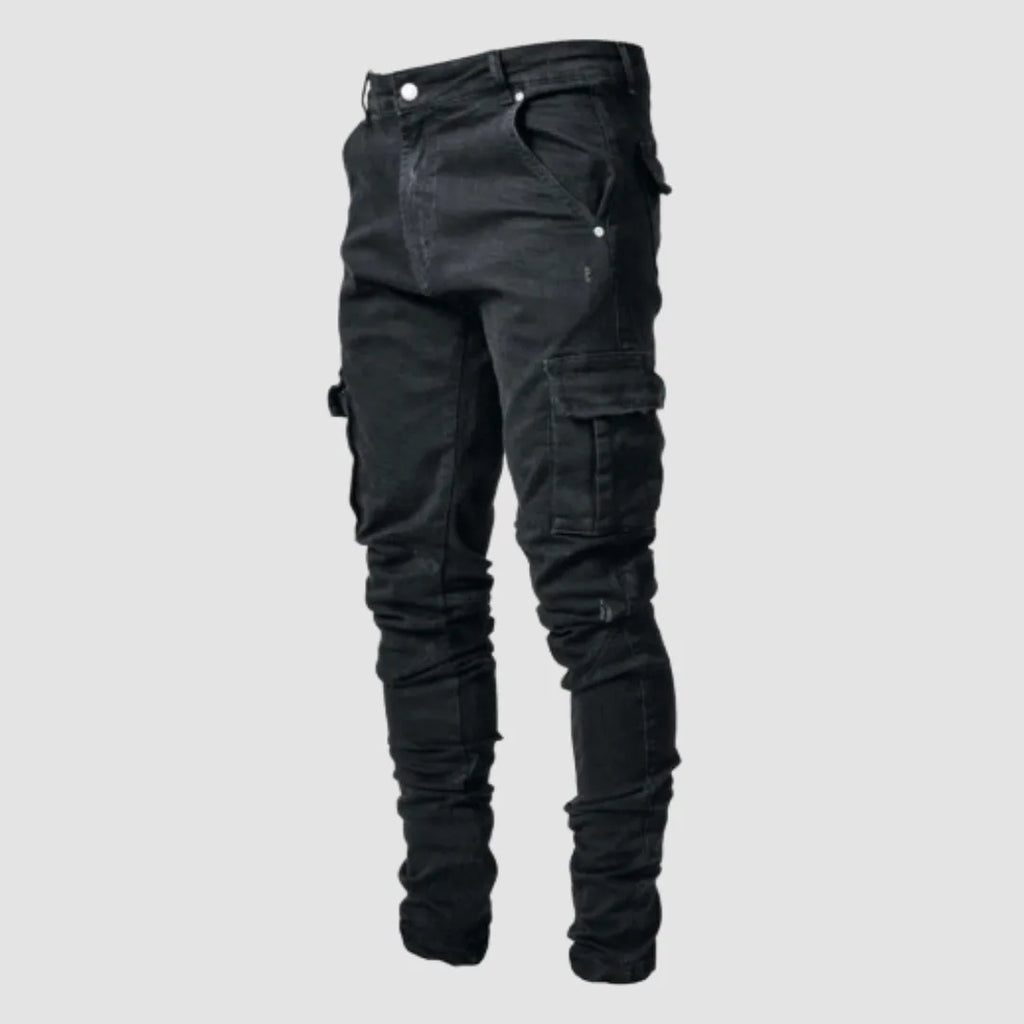 Black denim cargo jeans with a slim tapered fit and side thigh pocket, shown against a plain background.