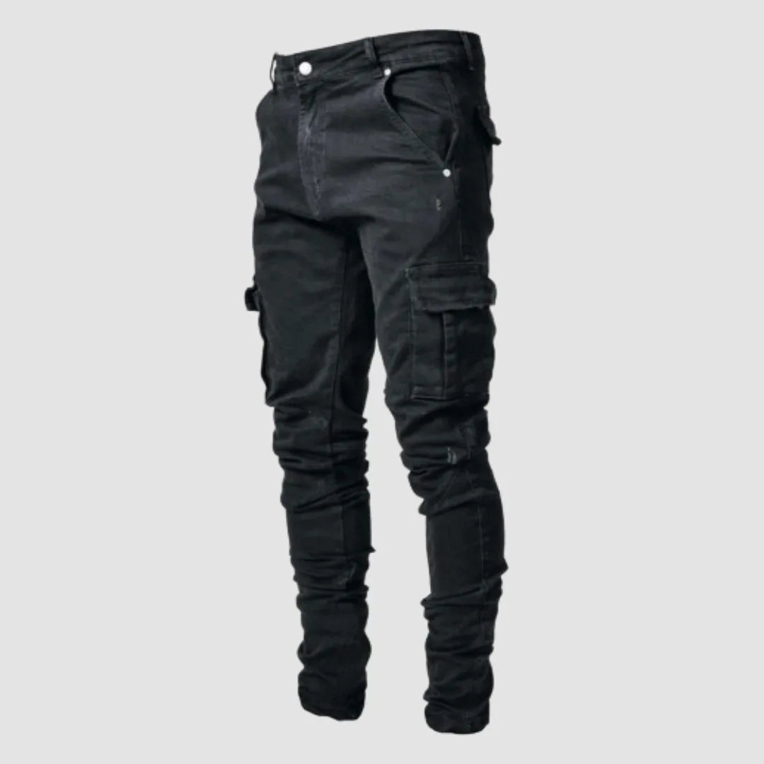 Black denim cargo jeans with a slim tapered fit and side thigh pocket, shown against a plain background.