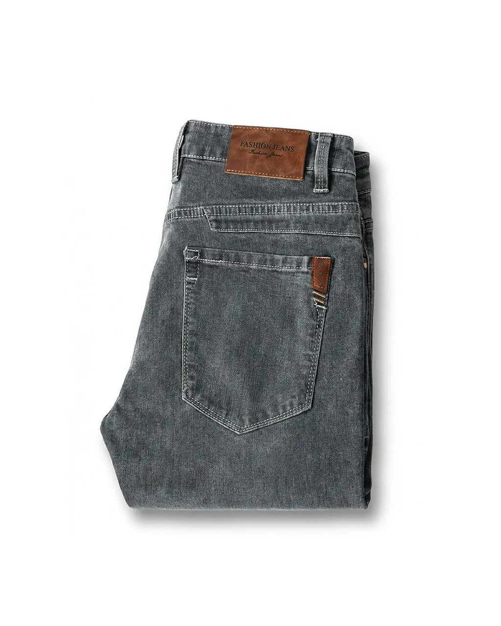 Folded grey denim jeans on white background showing rear leather patch and back pocket stitching detail