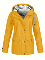 Mustard yellow rain jacket, front view, showing snap-button placket and two flap pockets
