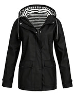 Black rain jacket with hood, showing zip and snap closure and two patch pockets with flaps