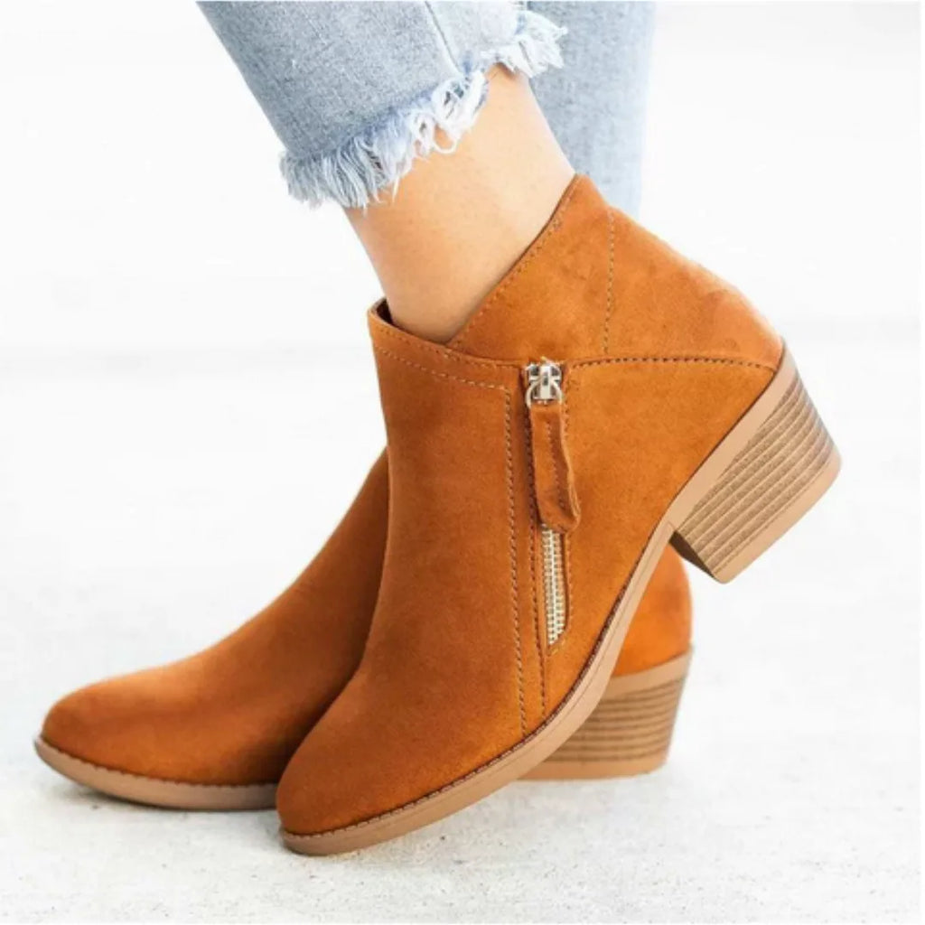Tan brown suede ankle boot shown from behind, highlighting the block heel and zip fastening