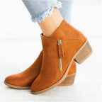 Tan brown suede ankle boot shown from behind, highlighting the block heel and zip fastening