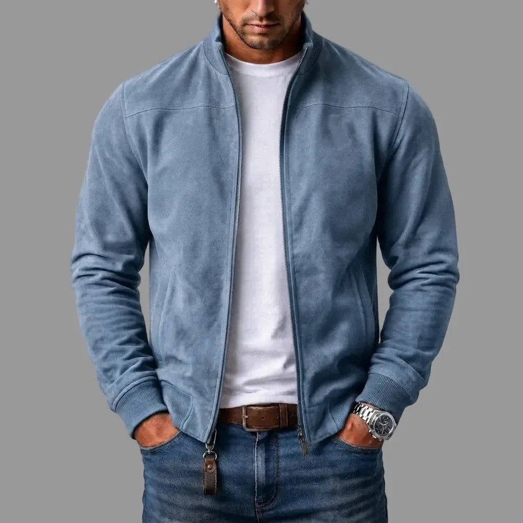 Blue suede jacket with stand collar shown unzipped, paired with a white tee and denim