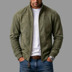 Olive green suede bomber jacket open at the front, highlighting the ribbed stand collar