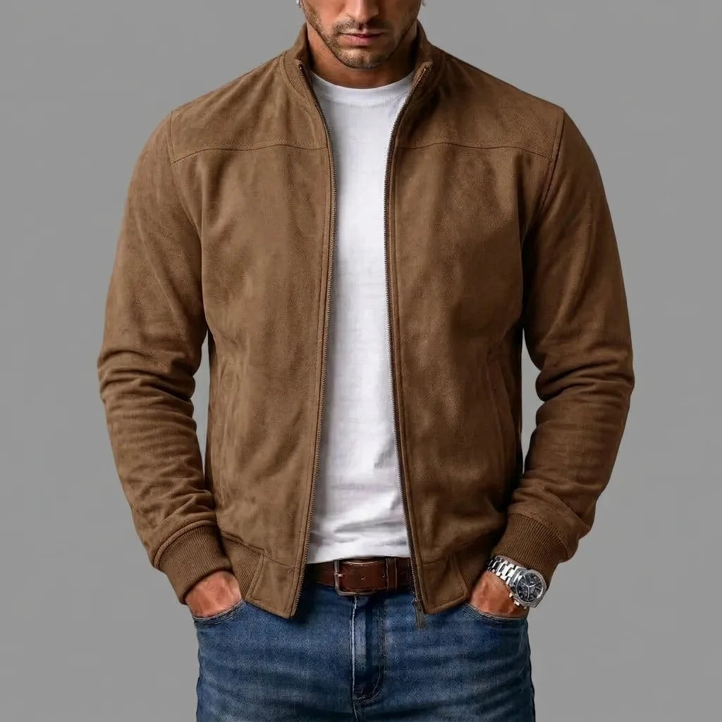 Brown suede jacket worn casually open, showing the shoulder seam and front zip