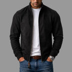 Black suede bomber jacket shown open, highlighting the sleek stand collar and zip closure