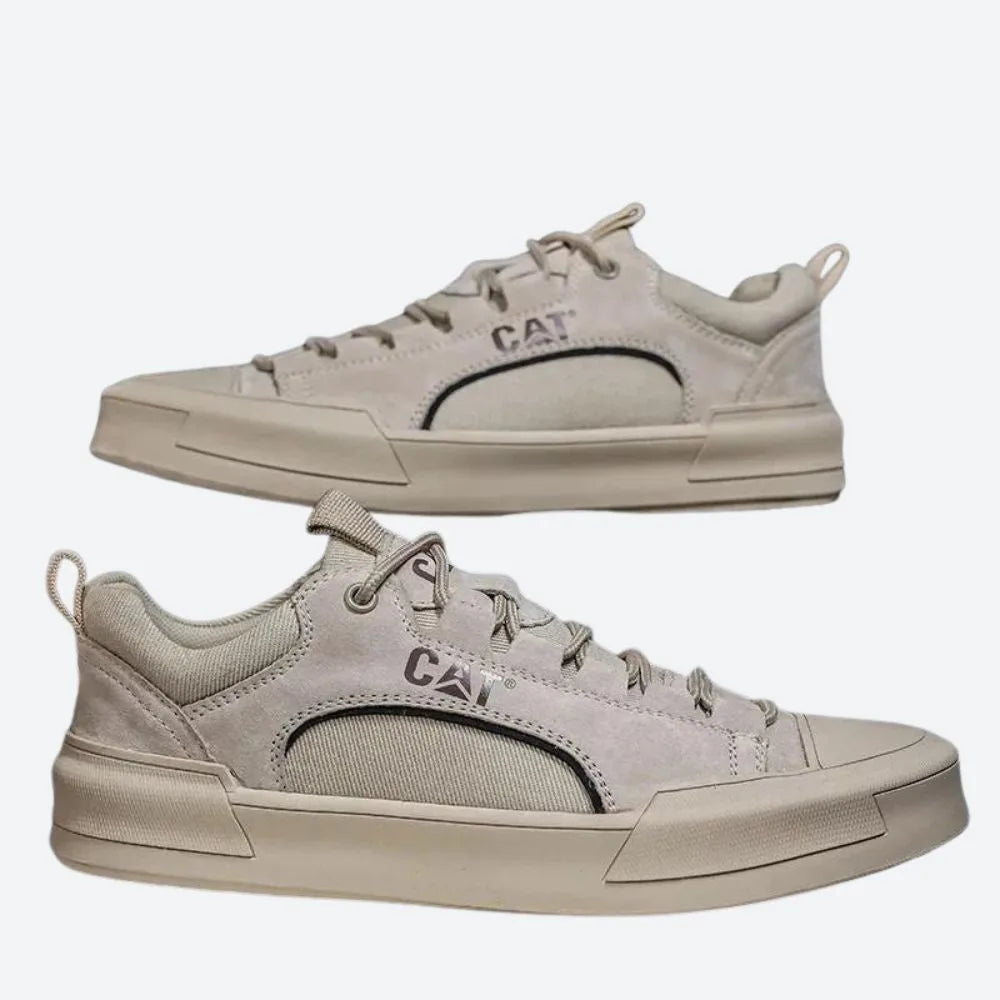 Side view pair of sand suede low-top trainers with canvas side panels and cream rubber sole
