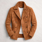 Tan suede double-breasted jacket with notch lapel and horn-style buttons, worn open over a white t-shirt