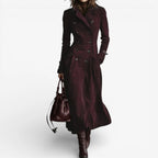 Deep red suede double-breasted longline coat with contrast piping and dark button detail