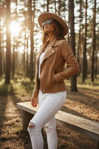 Close-up side profile of the tan suede-effect jacket showing the zipped pocket, collar shape and sleeve fit.