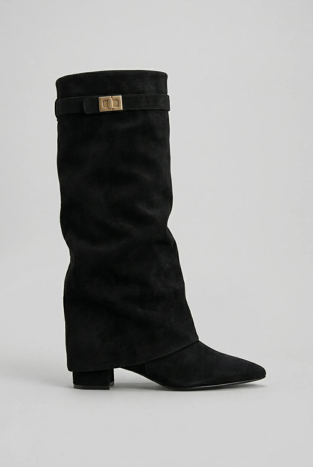 Side view of a black suede-effect knee-high boot with slouchy fold-over shaft and gold-tone buckle strap