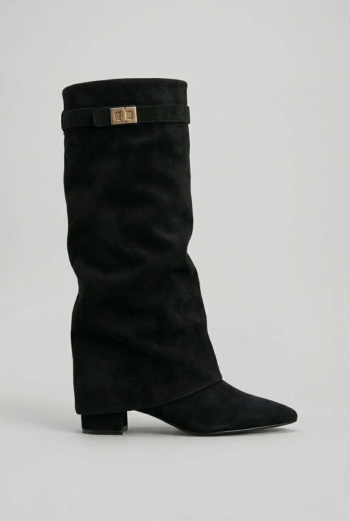 Side view of a black suede-effect knee-high boot with slouchy fold-over shaft and gold-tone buckle strap