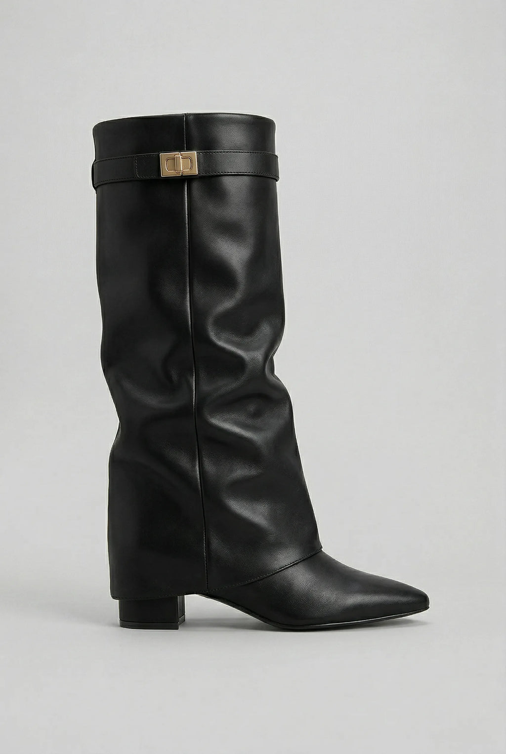 Side profile of a black leather-look knee-high boot with pointed toe and stacked block heel