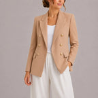Beige double-breasted blazer with gold buttons, close-up of tailored lapel and shoulder
